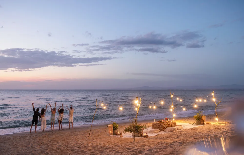 An evening gathering on a sandy beach